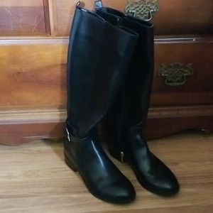 Black mid calf zip up boots.
